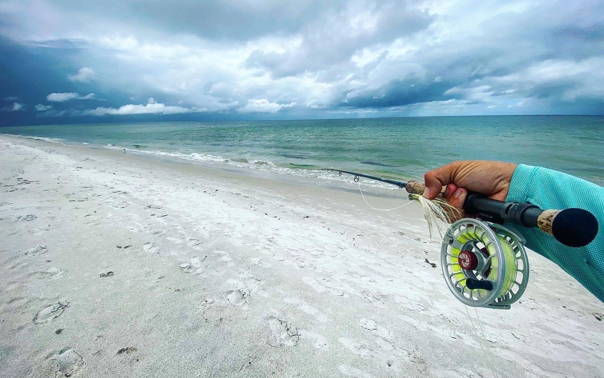 Author holding the Nautilus X reel inshore.