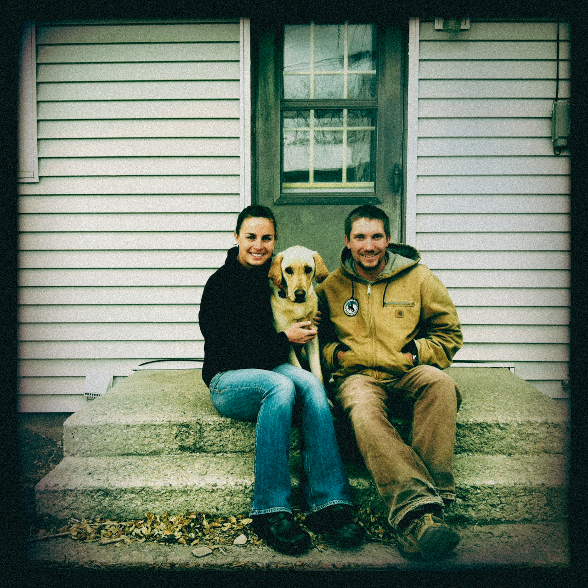 A family portrait on the front step of a house in Wyoming.