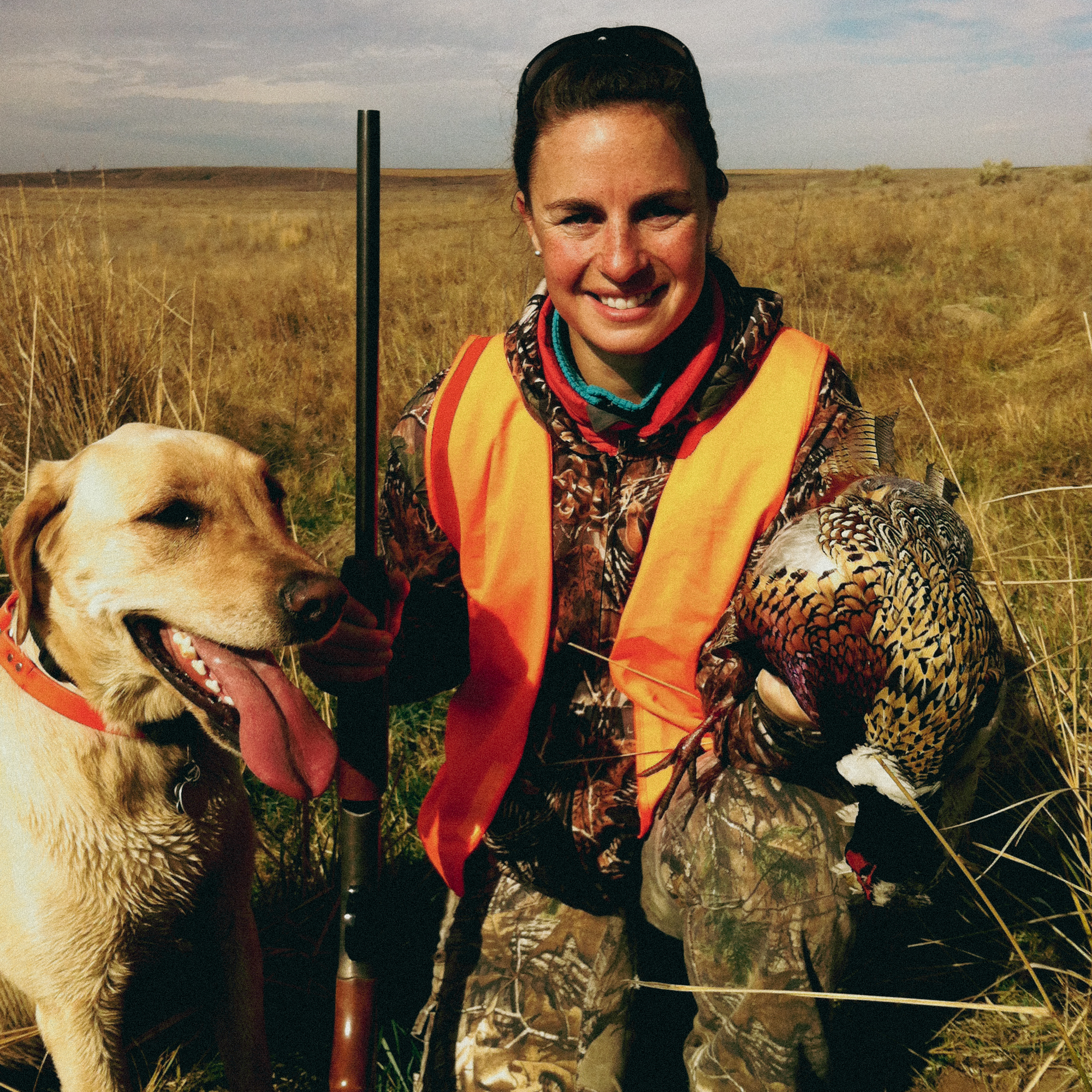 A hunter and her bird dog.