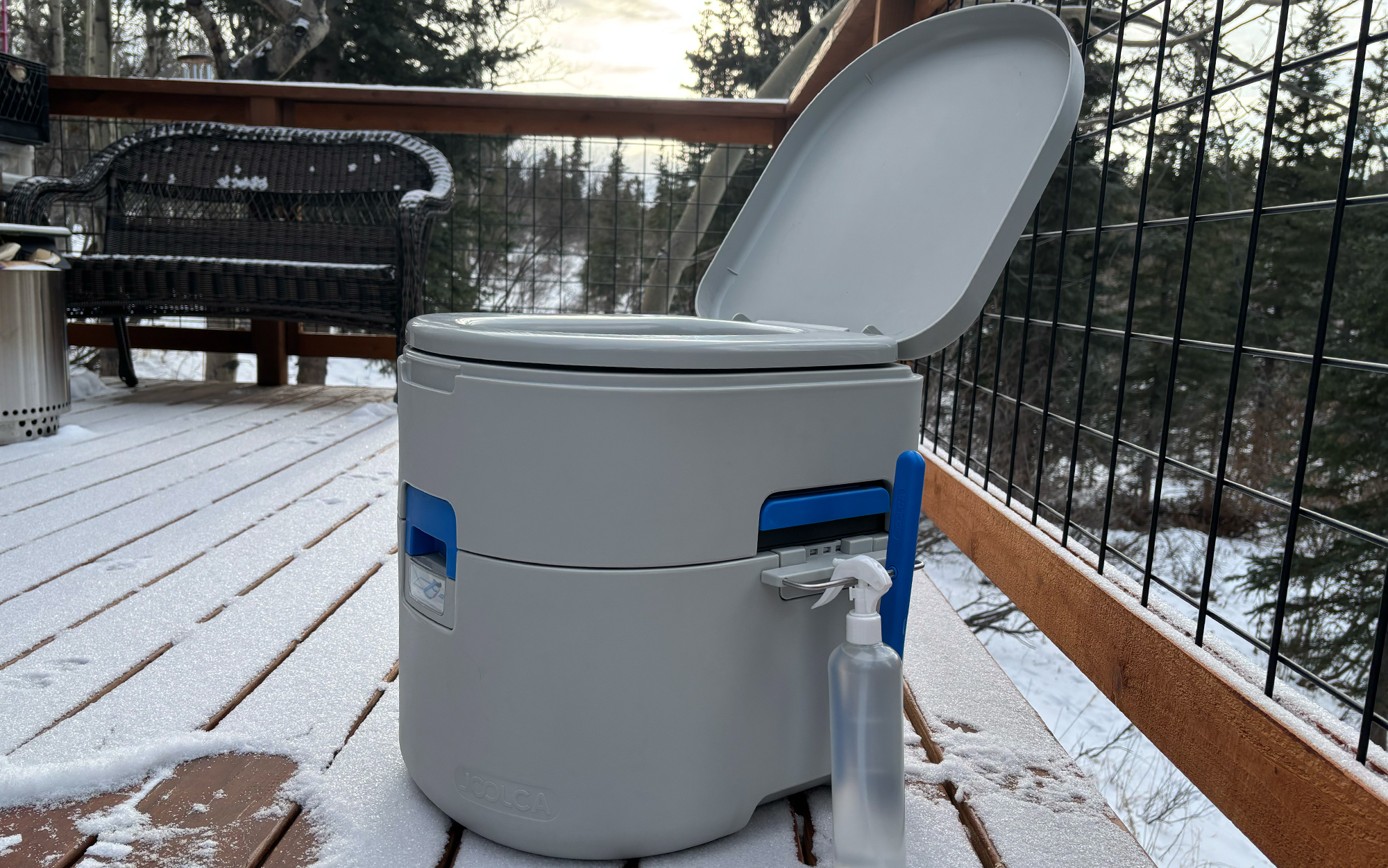 The Joolca composting toilet sits on a snowy deck.