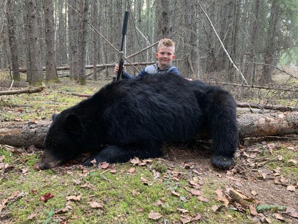 boy with a black bear