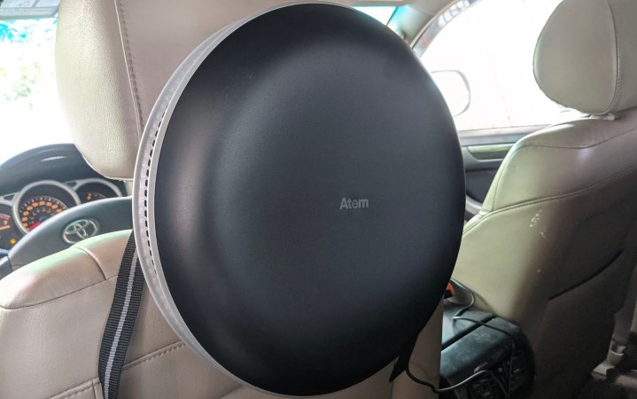  IQ Atem air purifier attached to the back of the driver's seat inside a Toyota 4runner