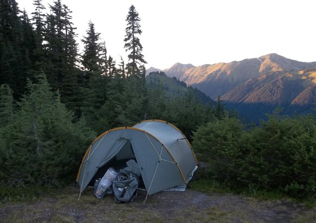 A tent with a footprint is set up outdoors.