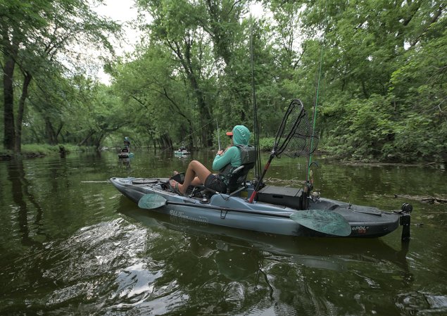 Woman fishes in the Old Town Watercraft BigWater ePDL.