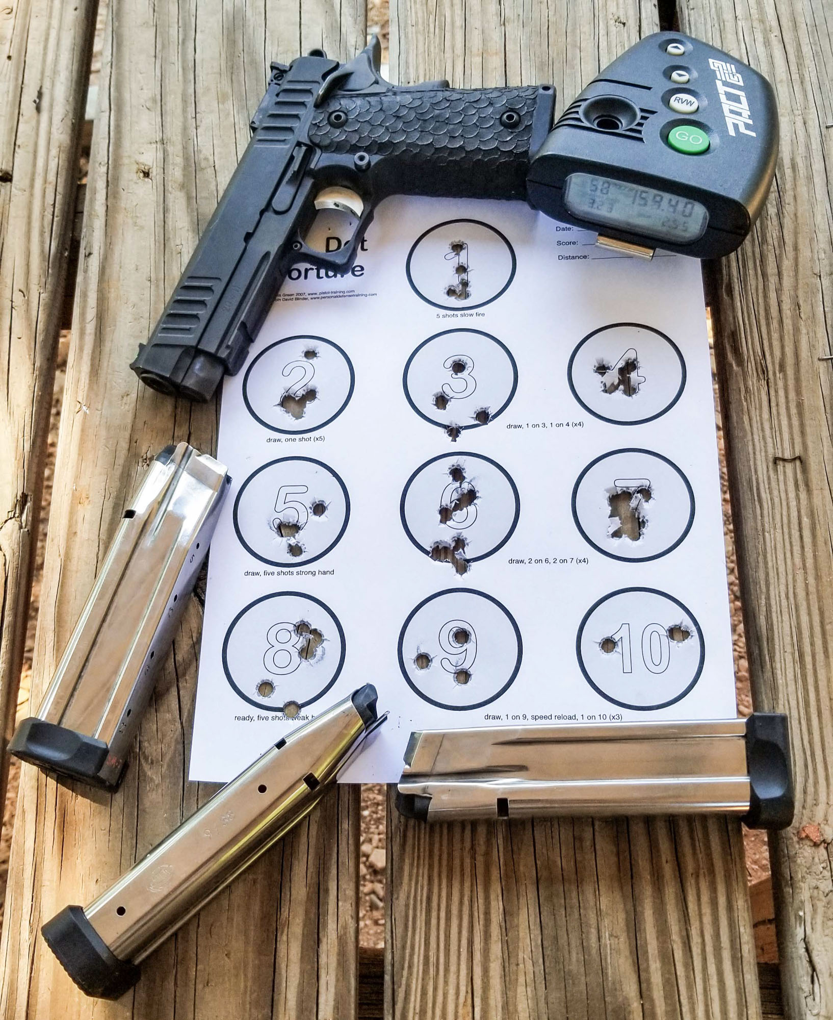 Stacatto P on table with dot drill target and Pact shot timer