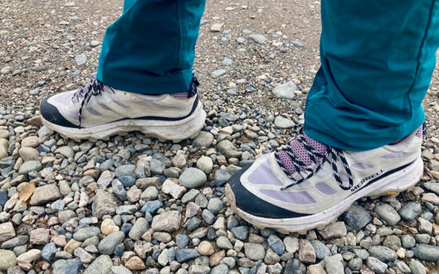 Authors wears Merrell Moab Speeds on rocks.