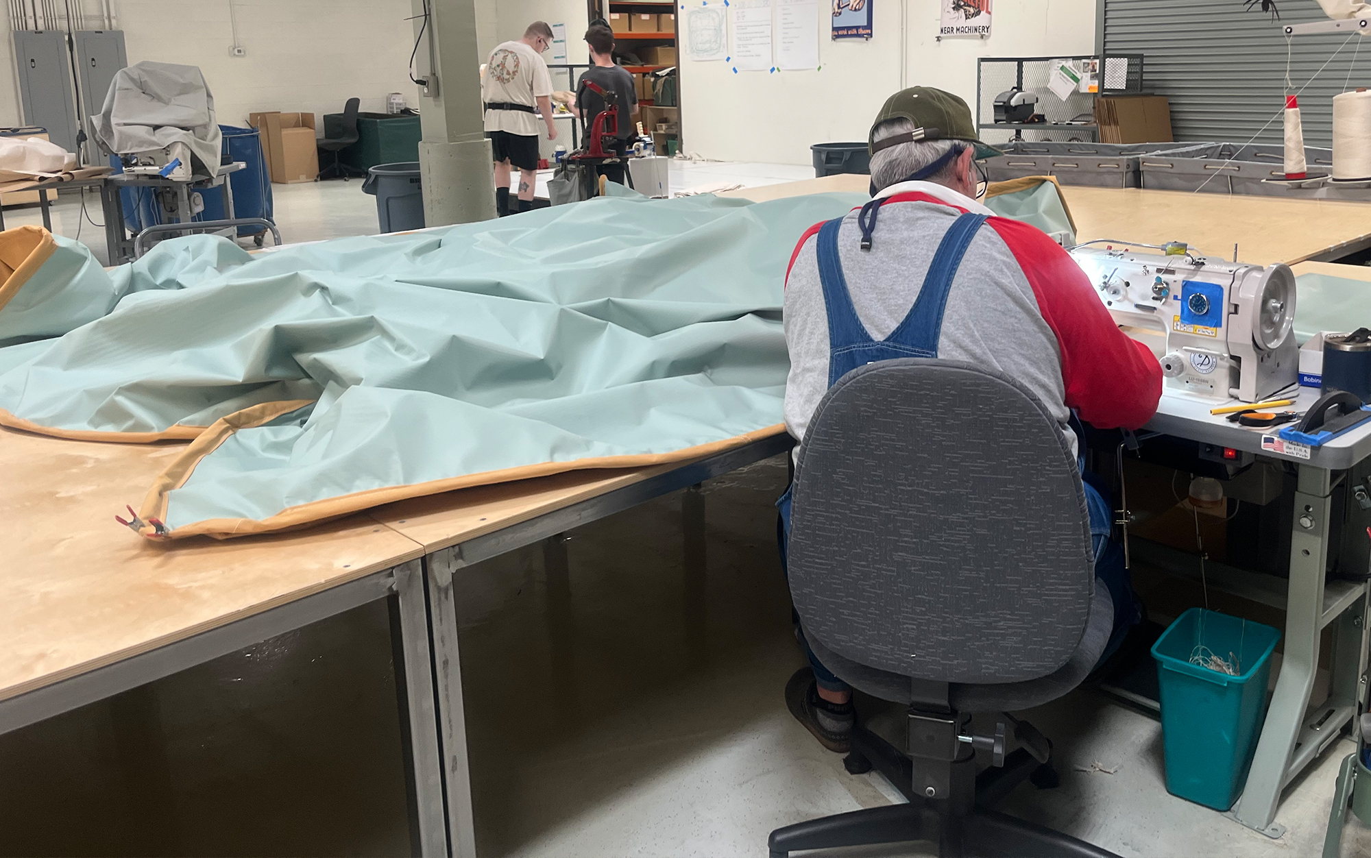 Here you can see a Springbar tent maker working on the waterproof floor’s perimeter rope.