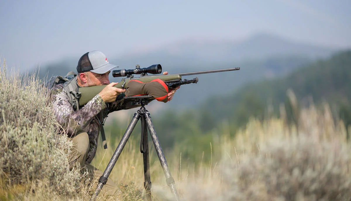 Shooting bag on tripod in the field.