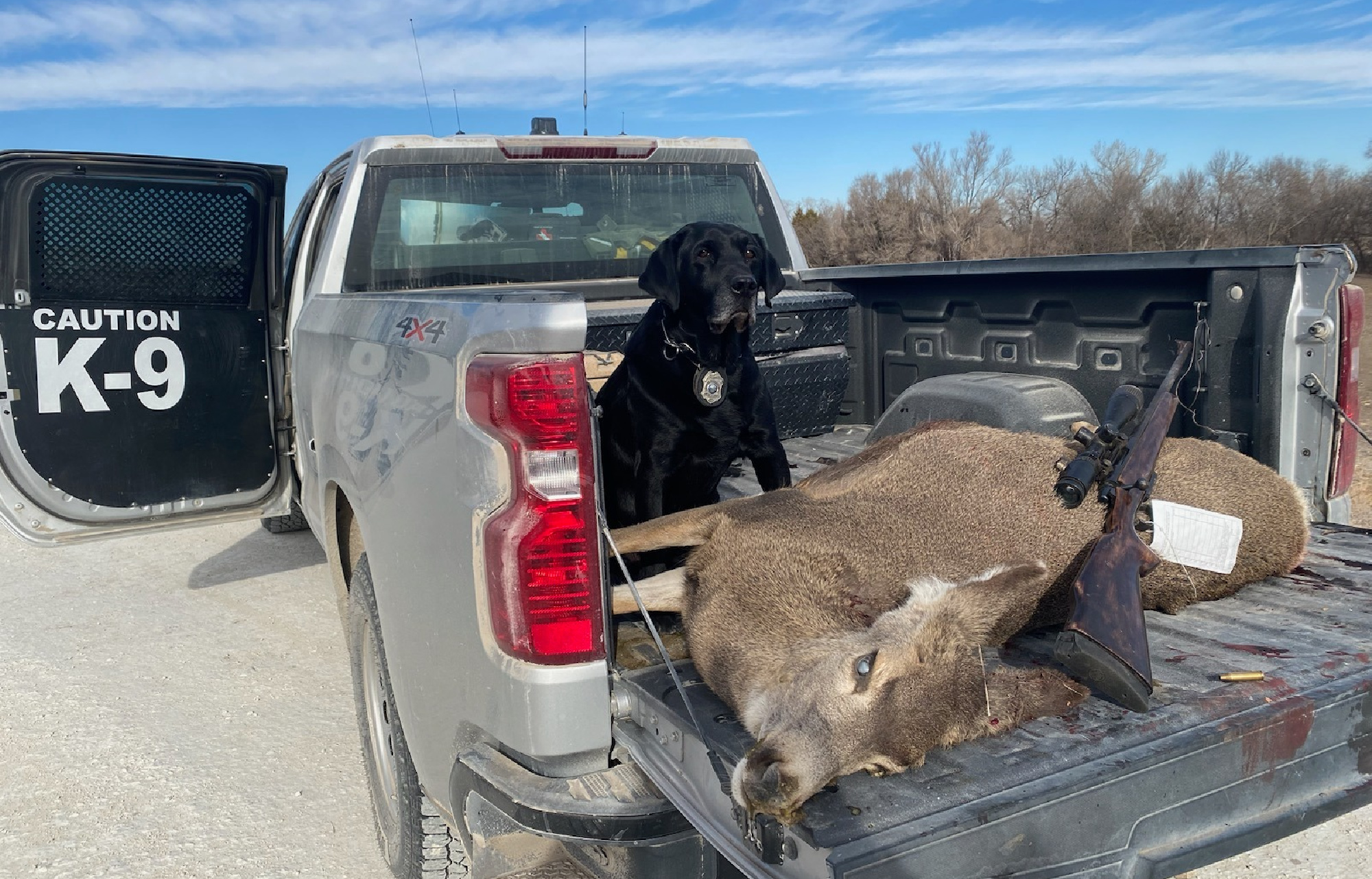 kreed with a mule deer