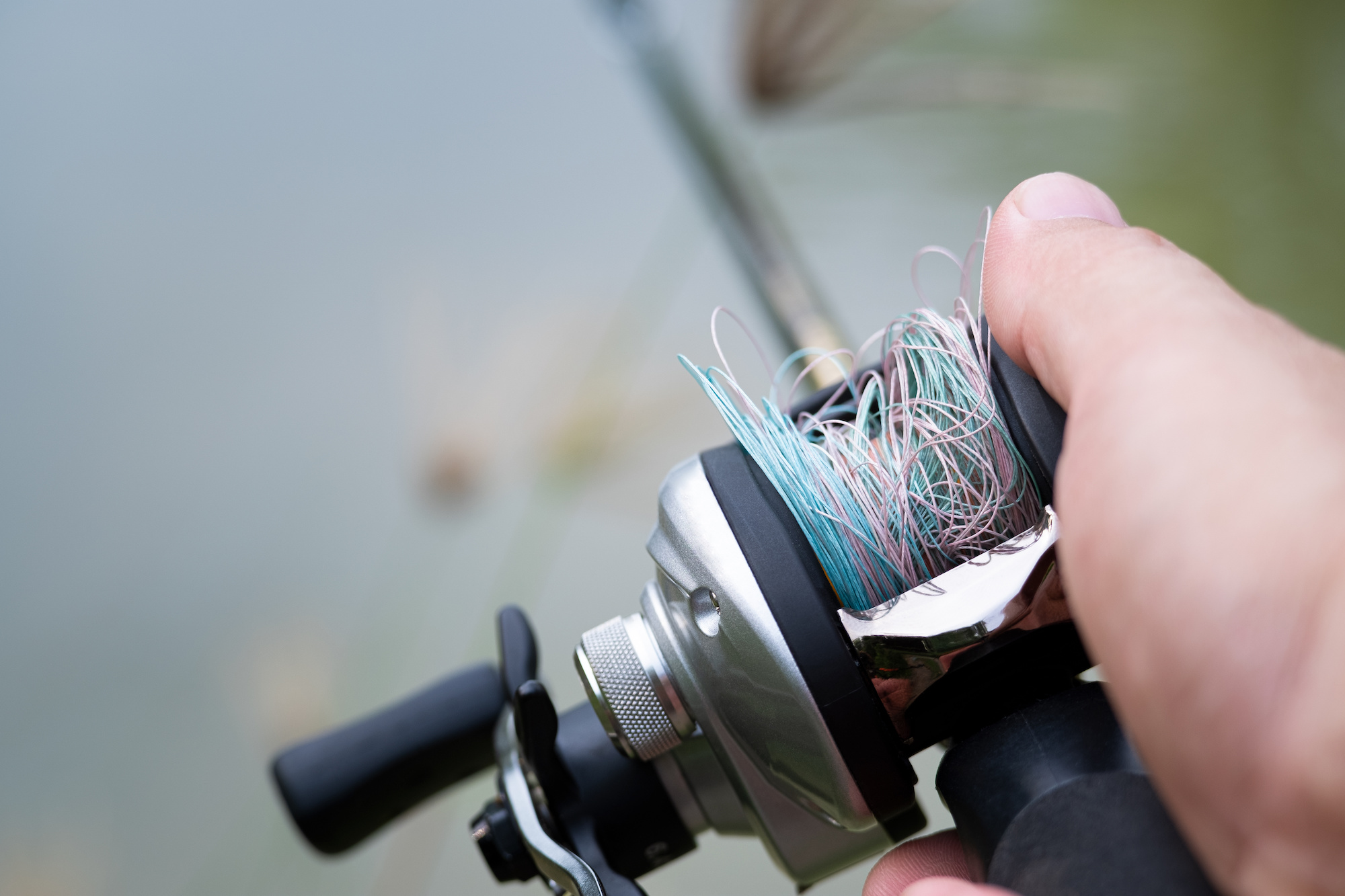 How to Spool a Baitcasting Reel - How to Spool Baitcasters to Avoid  Birdsnests and Line Twist 