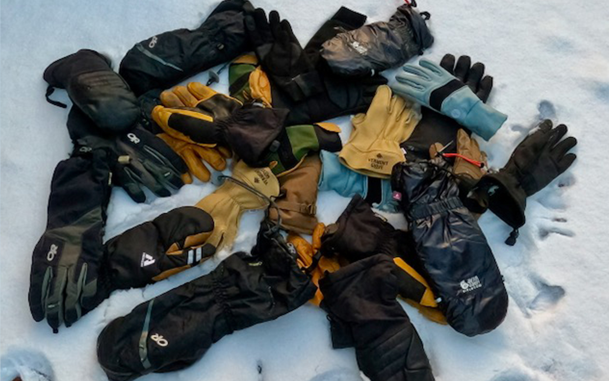 The best winter gloves sit in a pile.