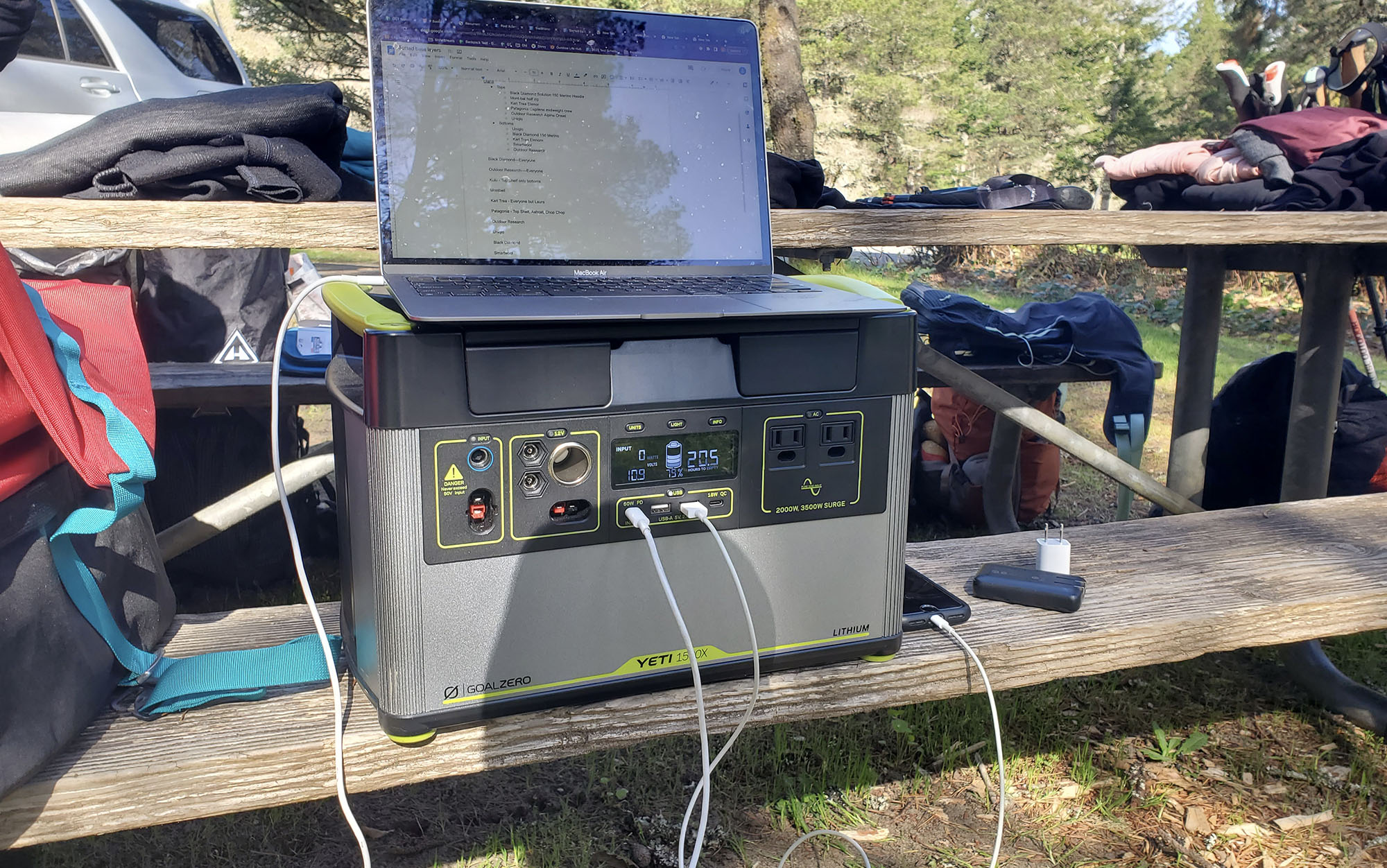 Power station with multiple plugs sitting on a picnic table