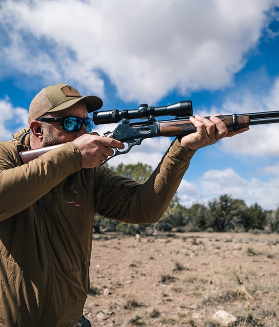 Shooting Editor John B. Snow rings steel with a lever-action rifle.