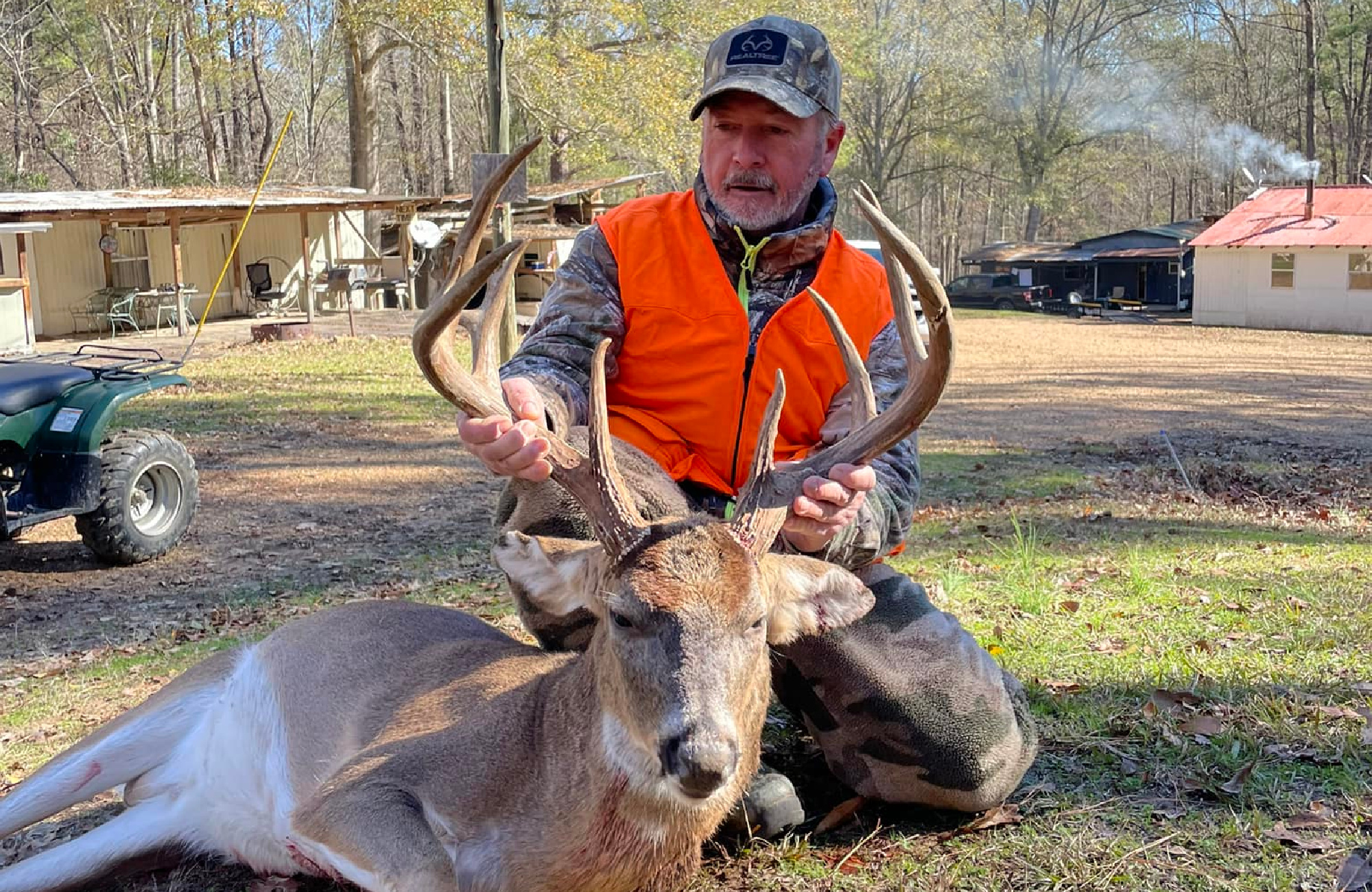 Rowdy Galjour poses with a large whitetail buck.