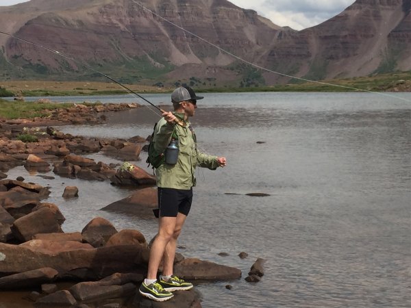 Brian Beckstead casts on the shore of a mountain lake.