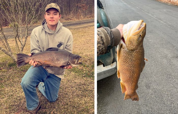 A teenager kneels with a fat tiger trout held in his hands, an dholds the fish by his tailgate.