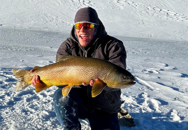 A Utah fisherman with a giant tiger trout.