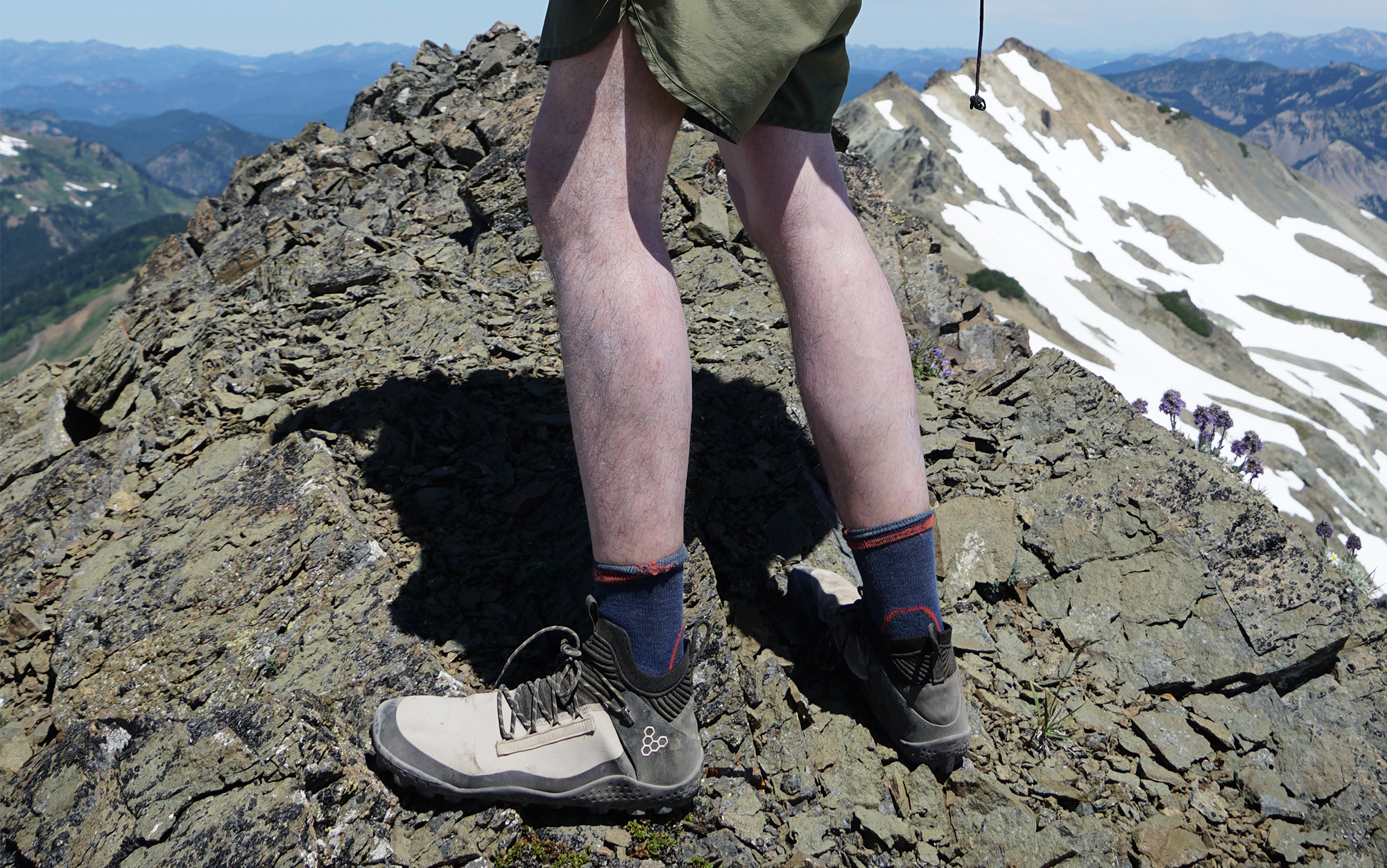 Vivobarefoot Magna Lite barefoot hiking shoes on top of a rocky ridge