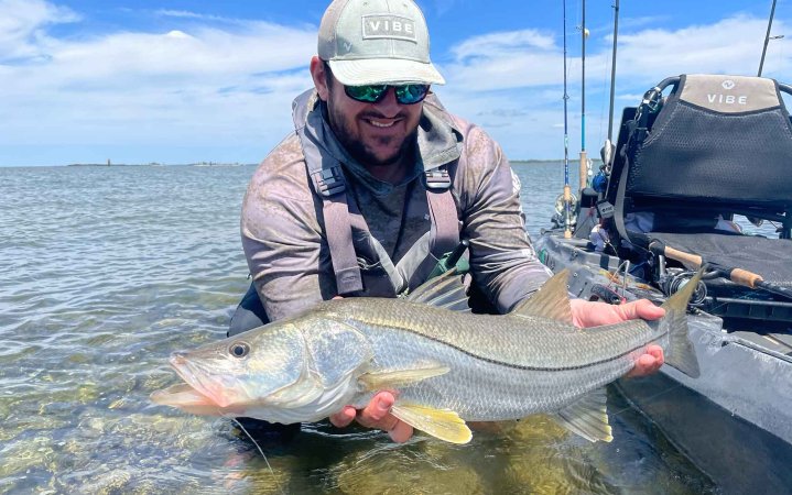 Author holds fish caught with one of the best inshore spinning rods.