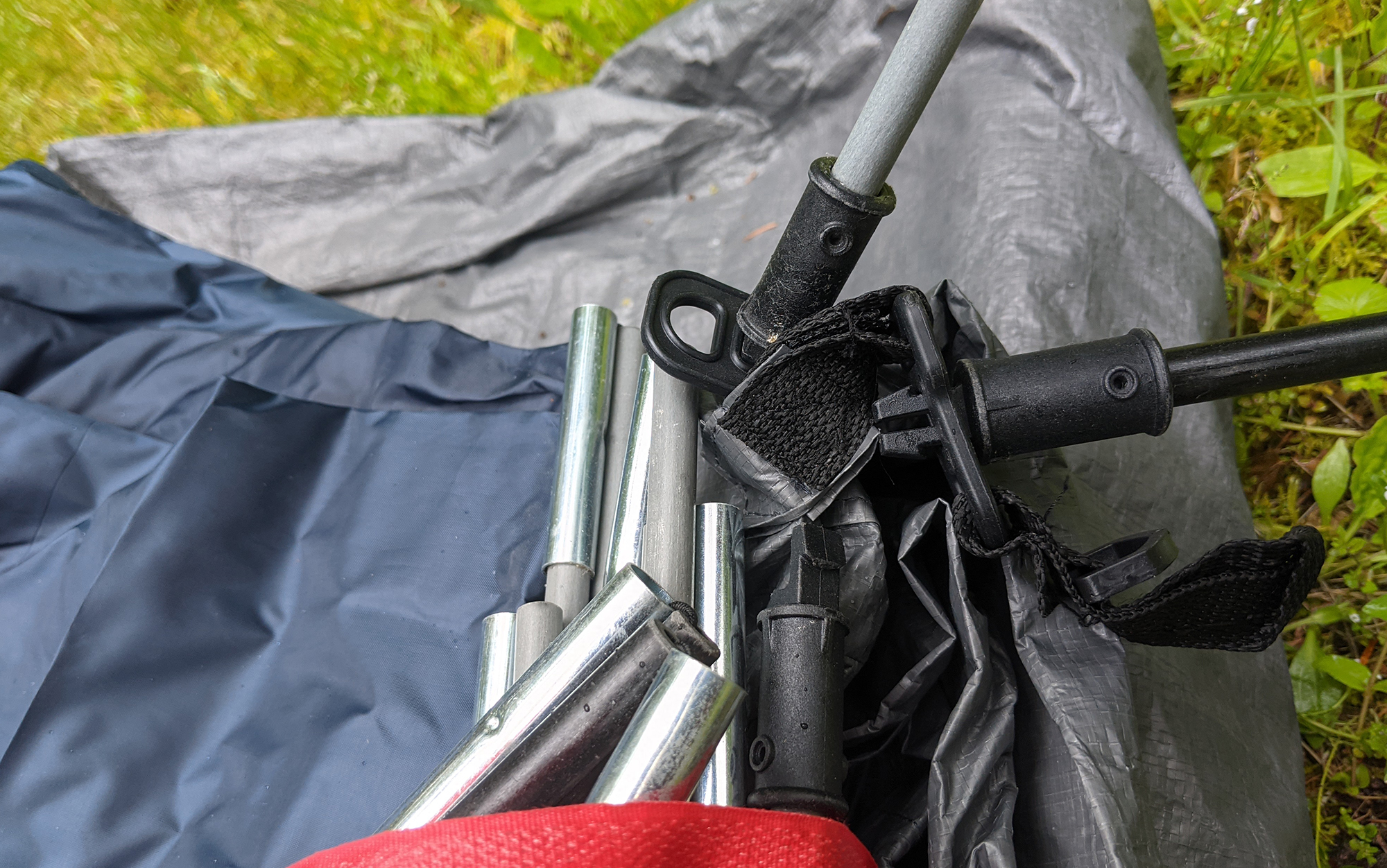The Coleman tent poles are attached to the tent fabric.