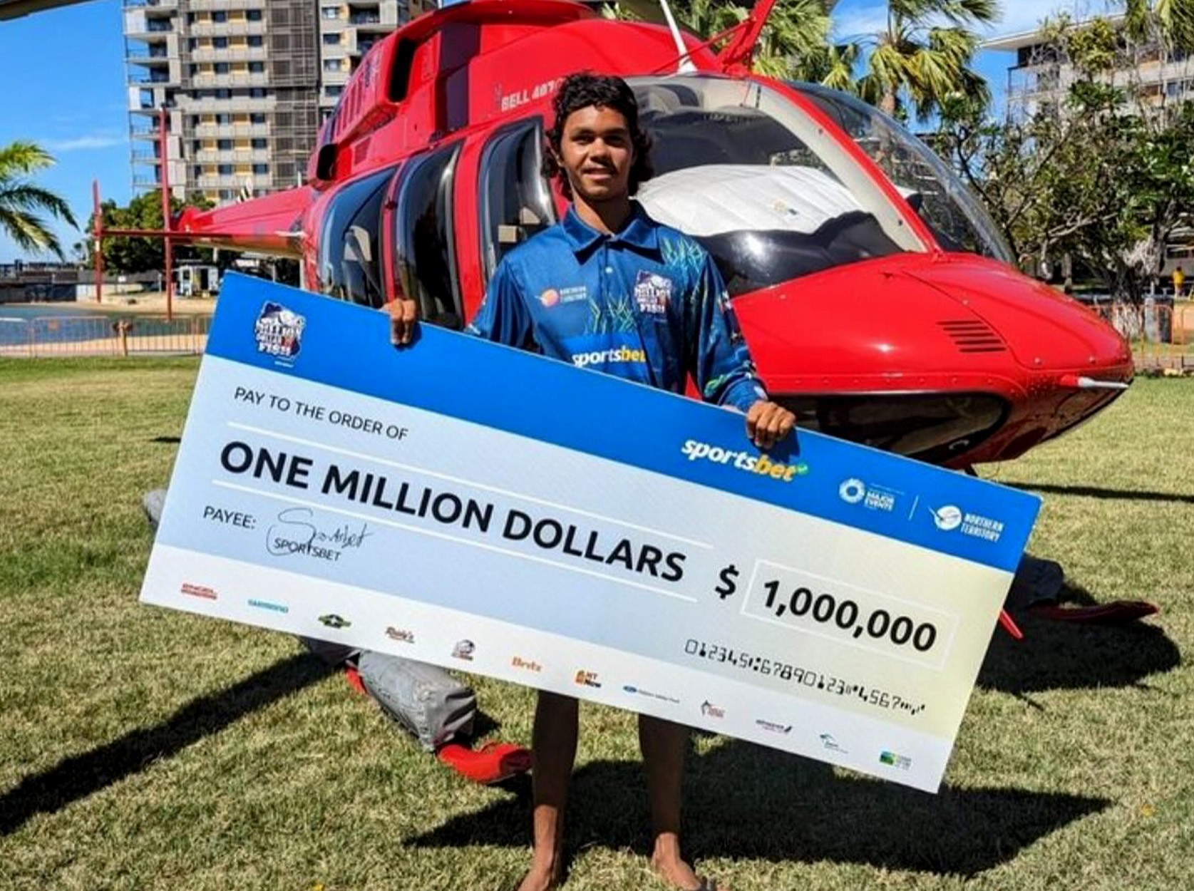 Australian angler with million-dollar check.
