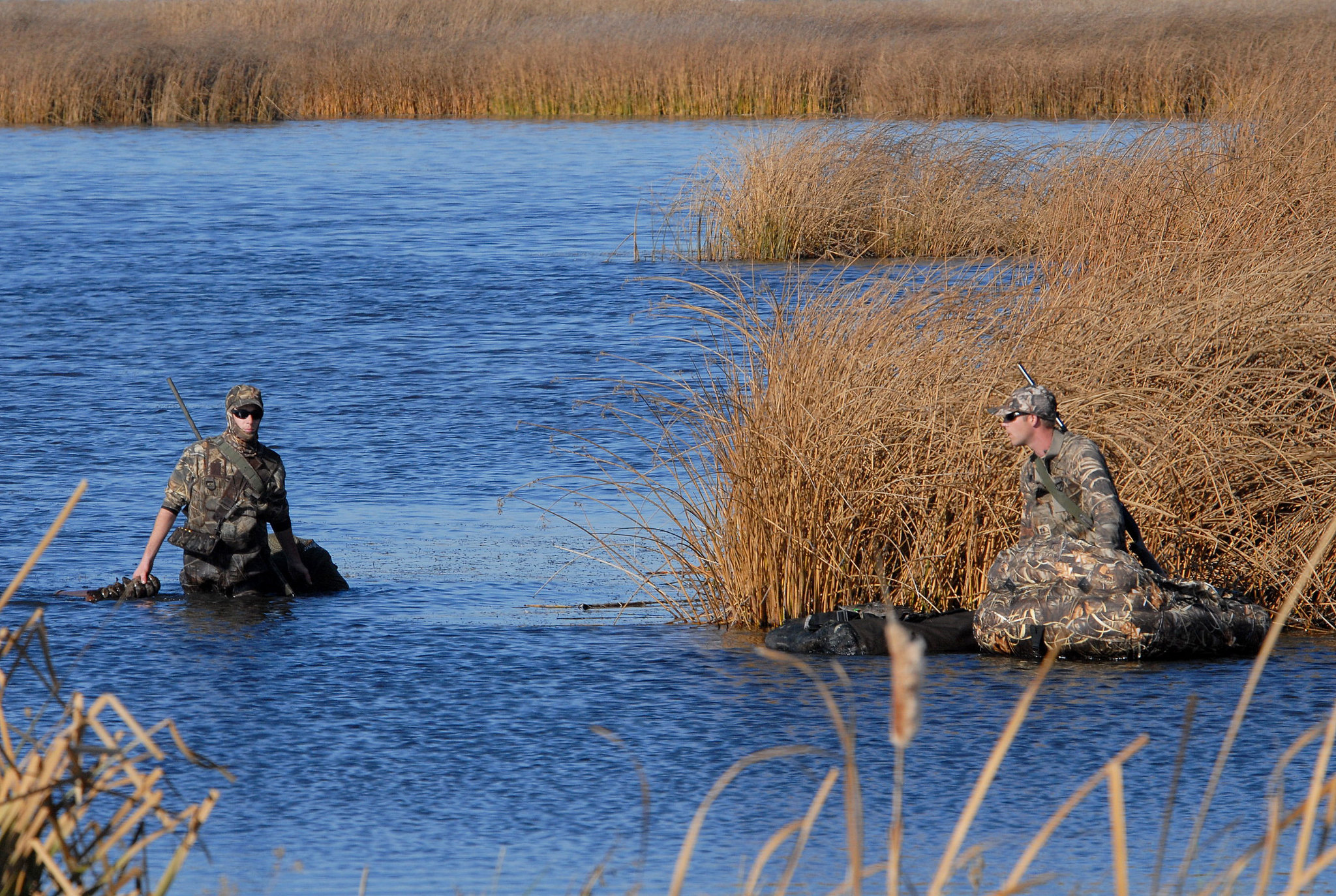 A pair of duck hunters at a marsh managed under the NWR system.
