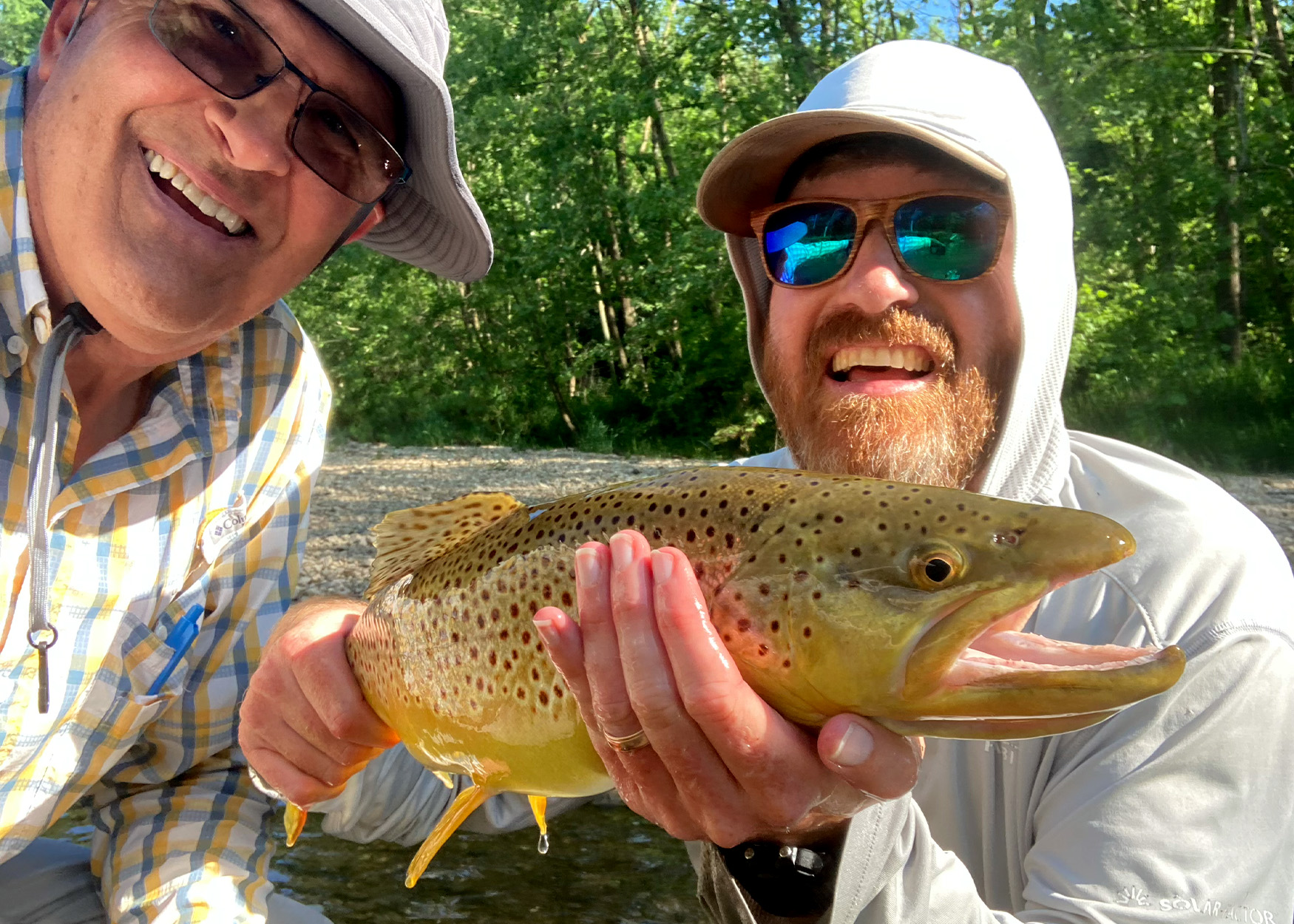 Two anglers with brown trout.