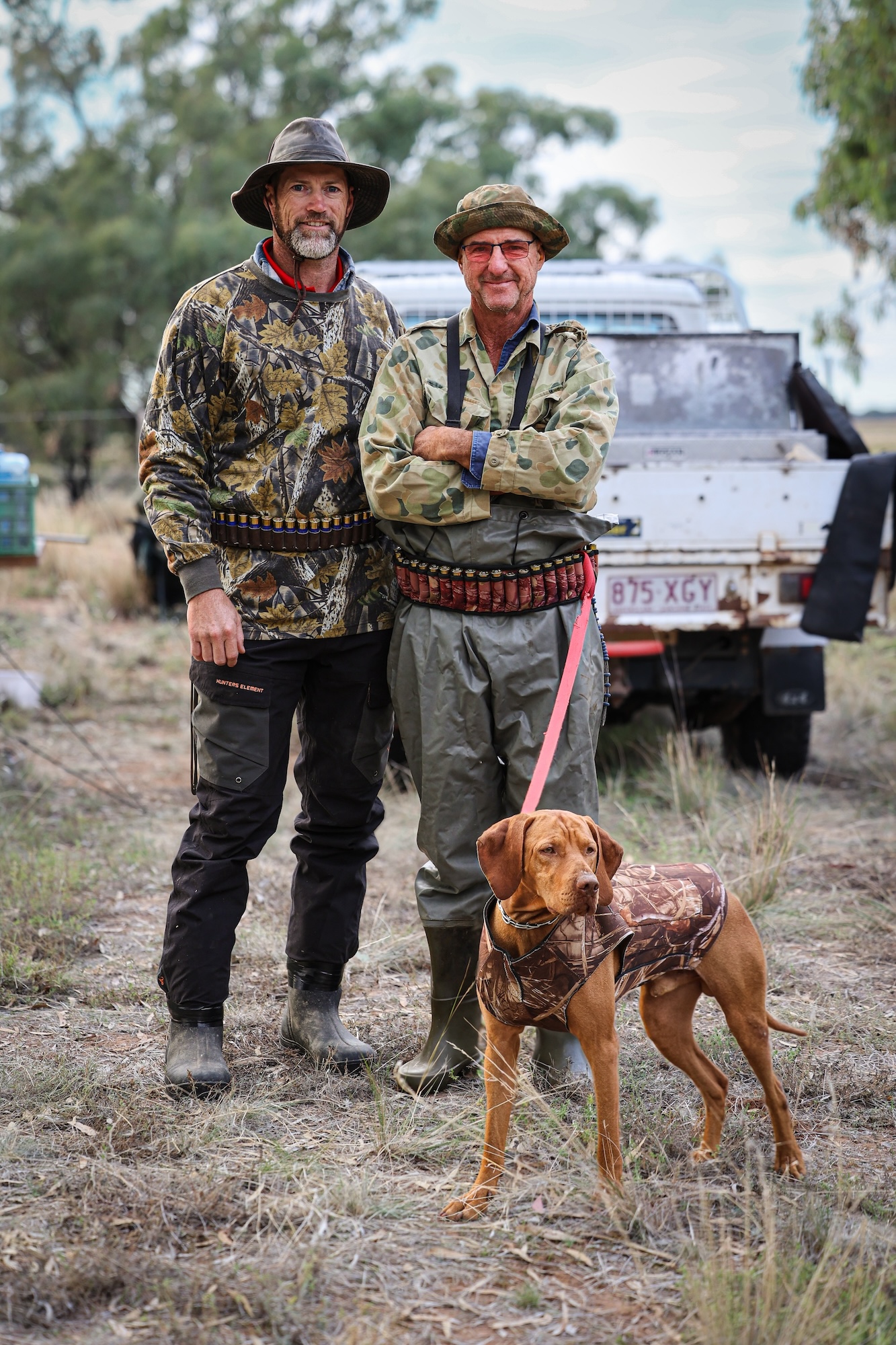 Duck hunters pose for a portrait in Australia.