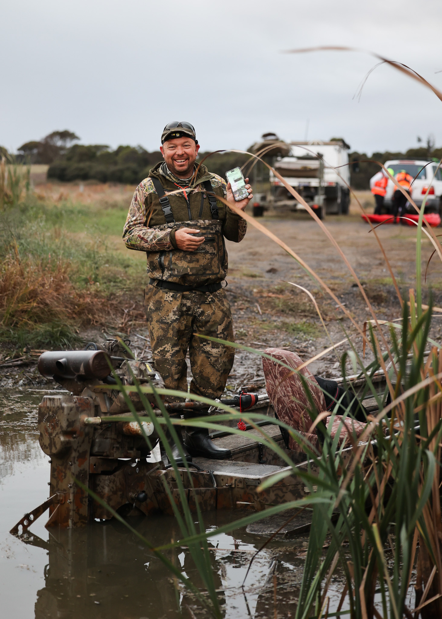 Trent Leen an Australian duck hunter laughs at the boat ramp.