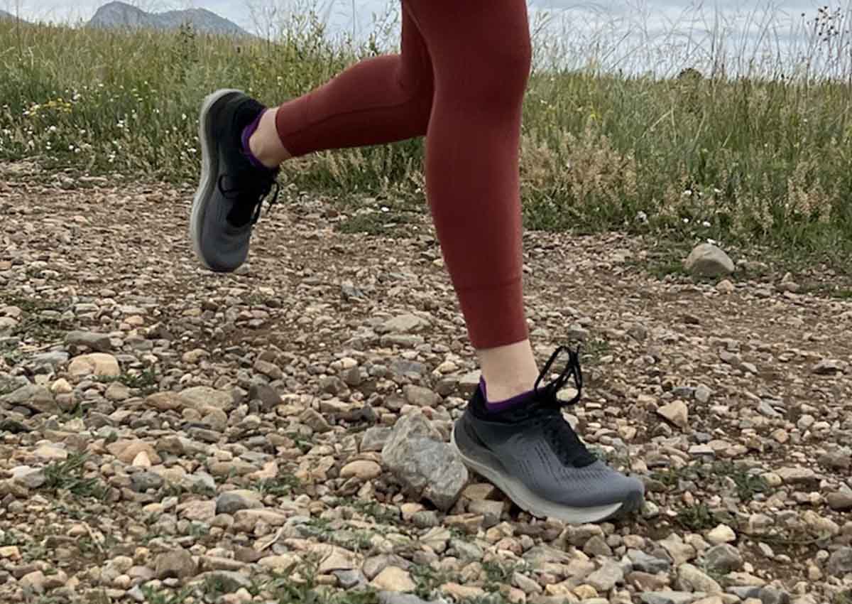 Runner wearing zero-drop shoes on rocky trail