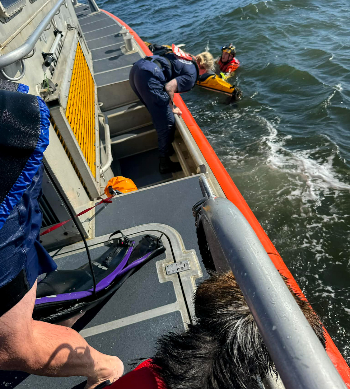 Coast guard rescues kayakers in bay.