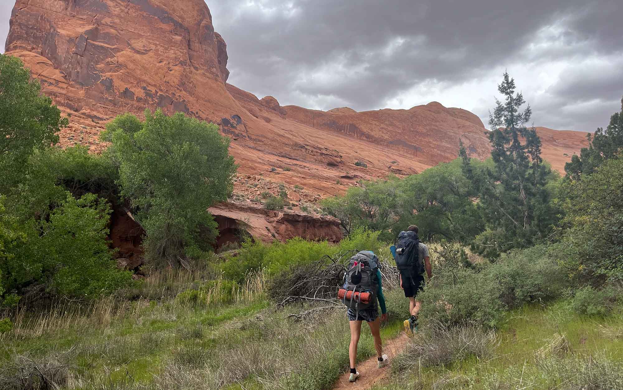 Backpackers walk single file on trail to leave no trace.