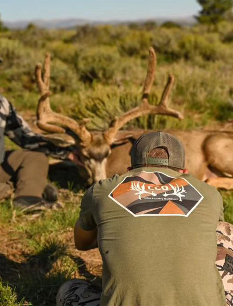 Utah hunting guide takes photo of buck.