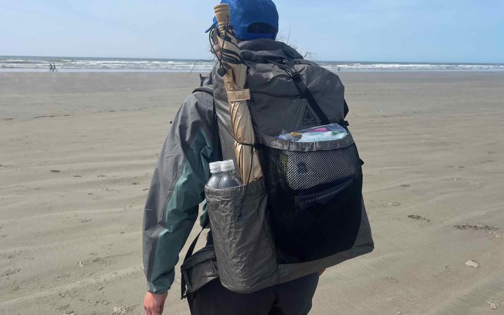  woman looking out at the ocean while wearing the Durston Kakwa 40 backpack