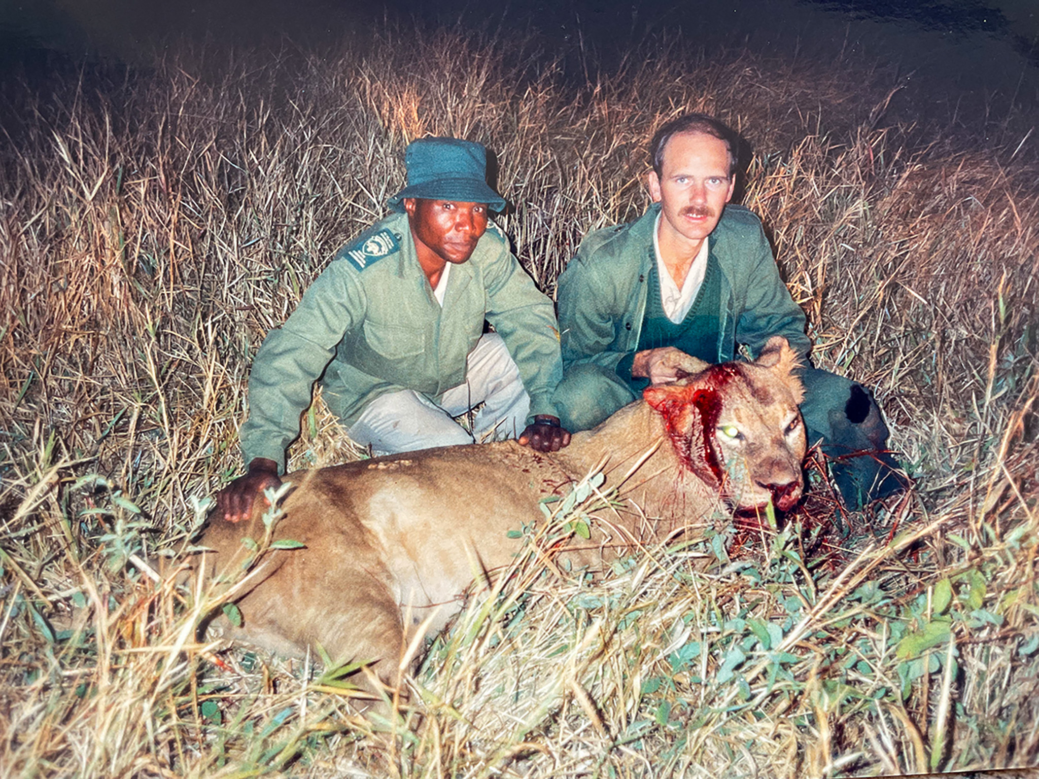 A South African warden and a problem animal control agent with a man-eating lion.