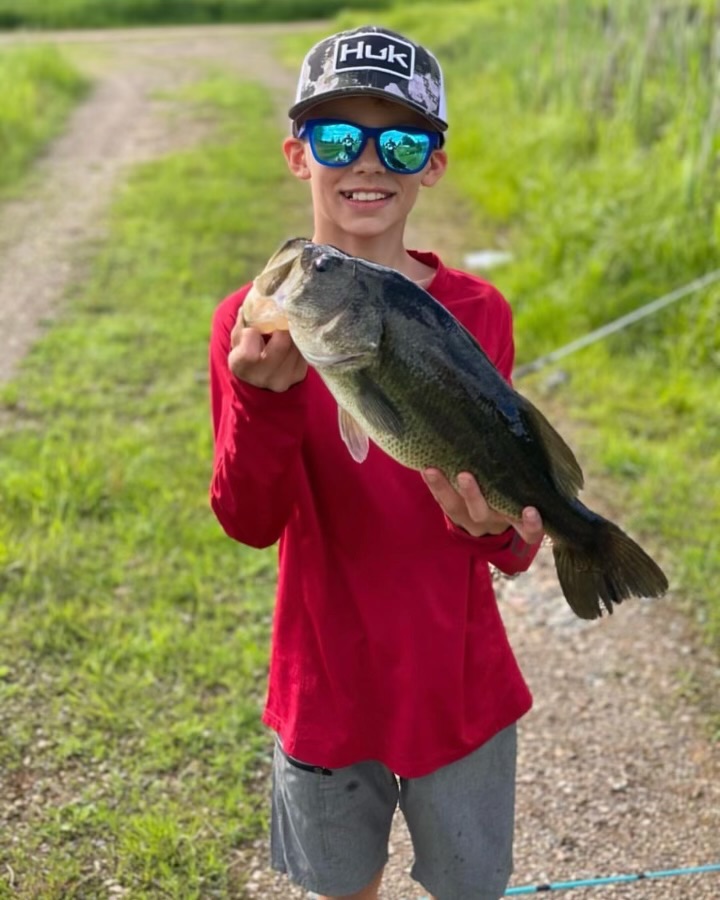 A kid with a nice fish.