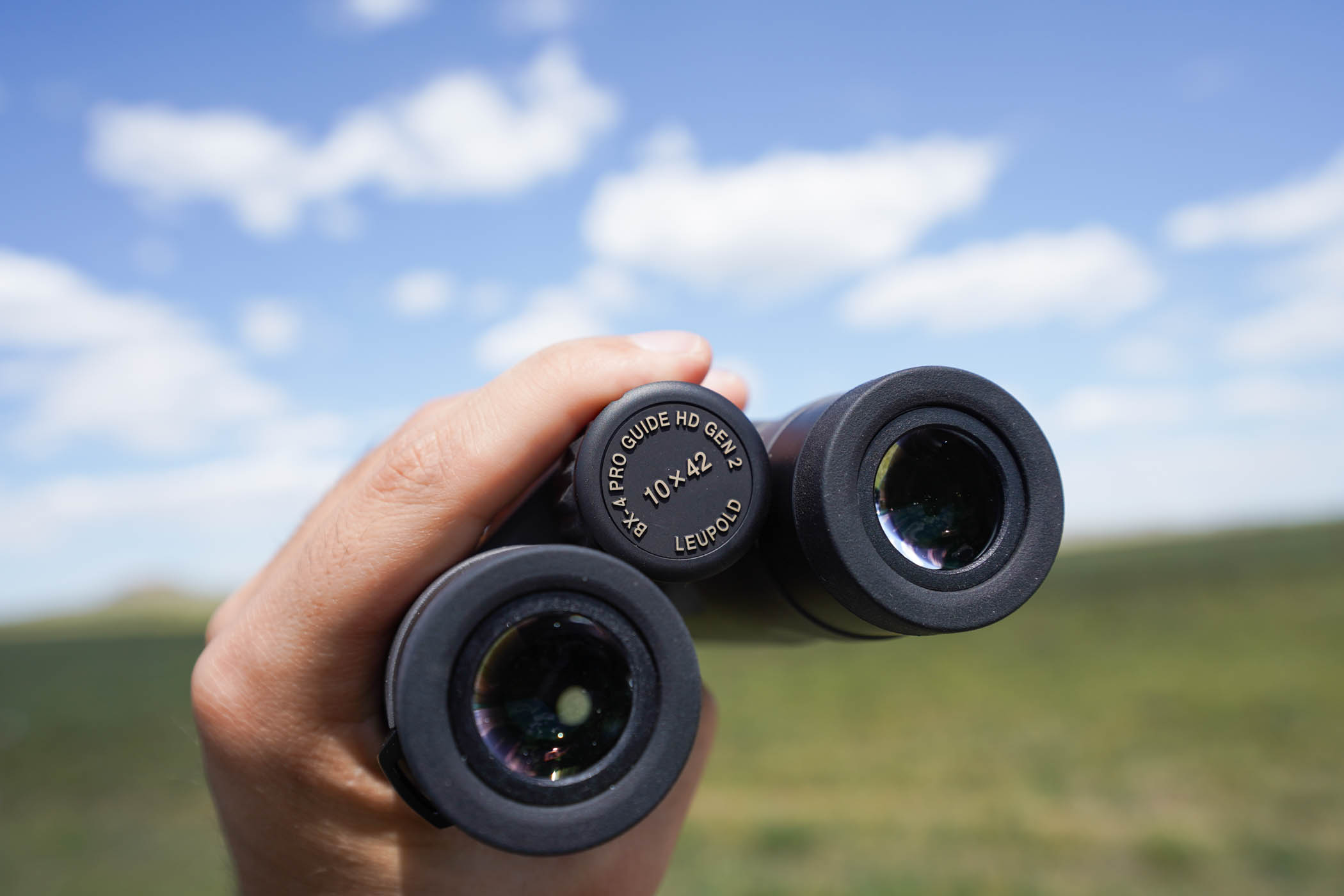 The pro guide binoculars in hand 