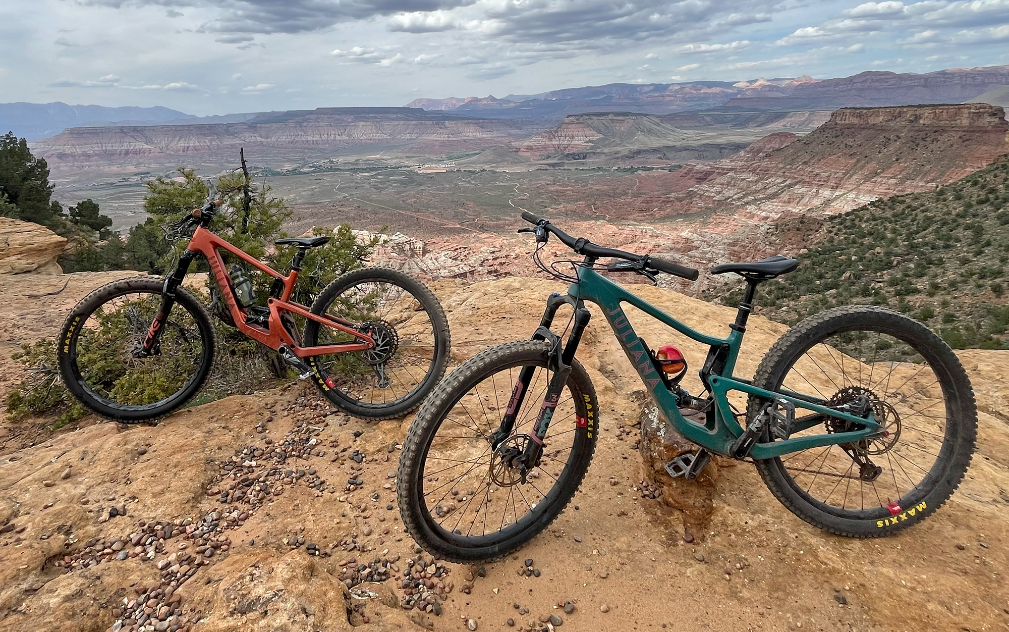 Two Juliana Furtados sit on canyon ledge.