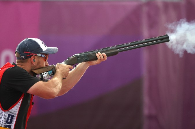 Vincent Hancock shooting a shotgun at the Tokyo Olympics.