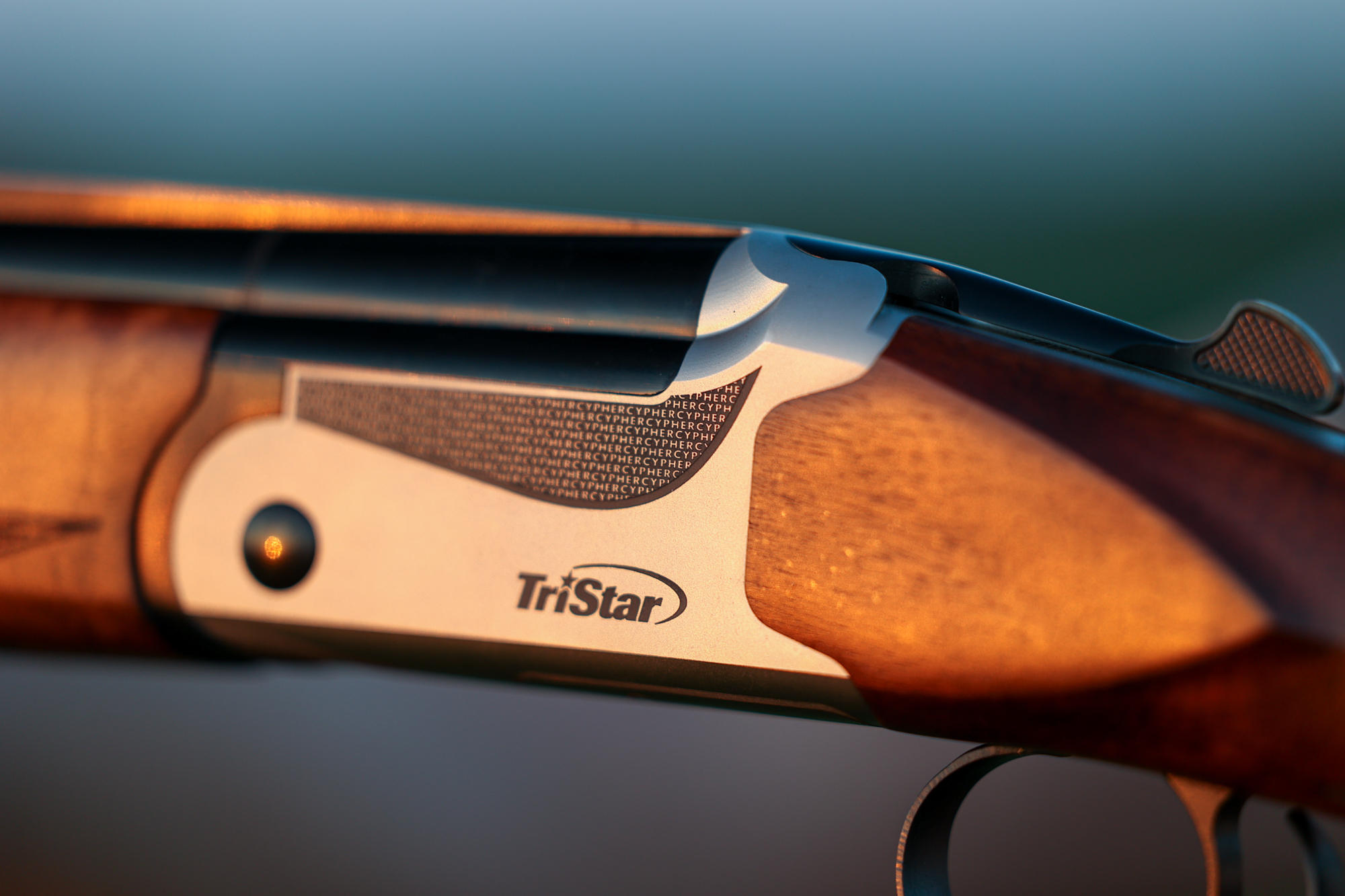 The Cypher text on the receiver of the Tristar shotgun.