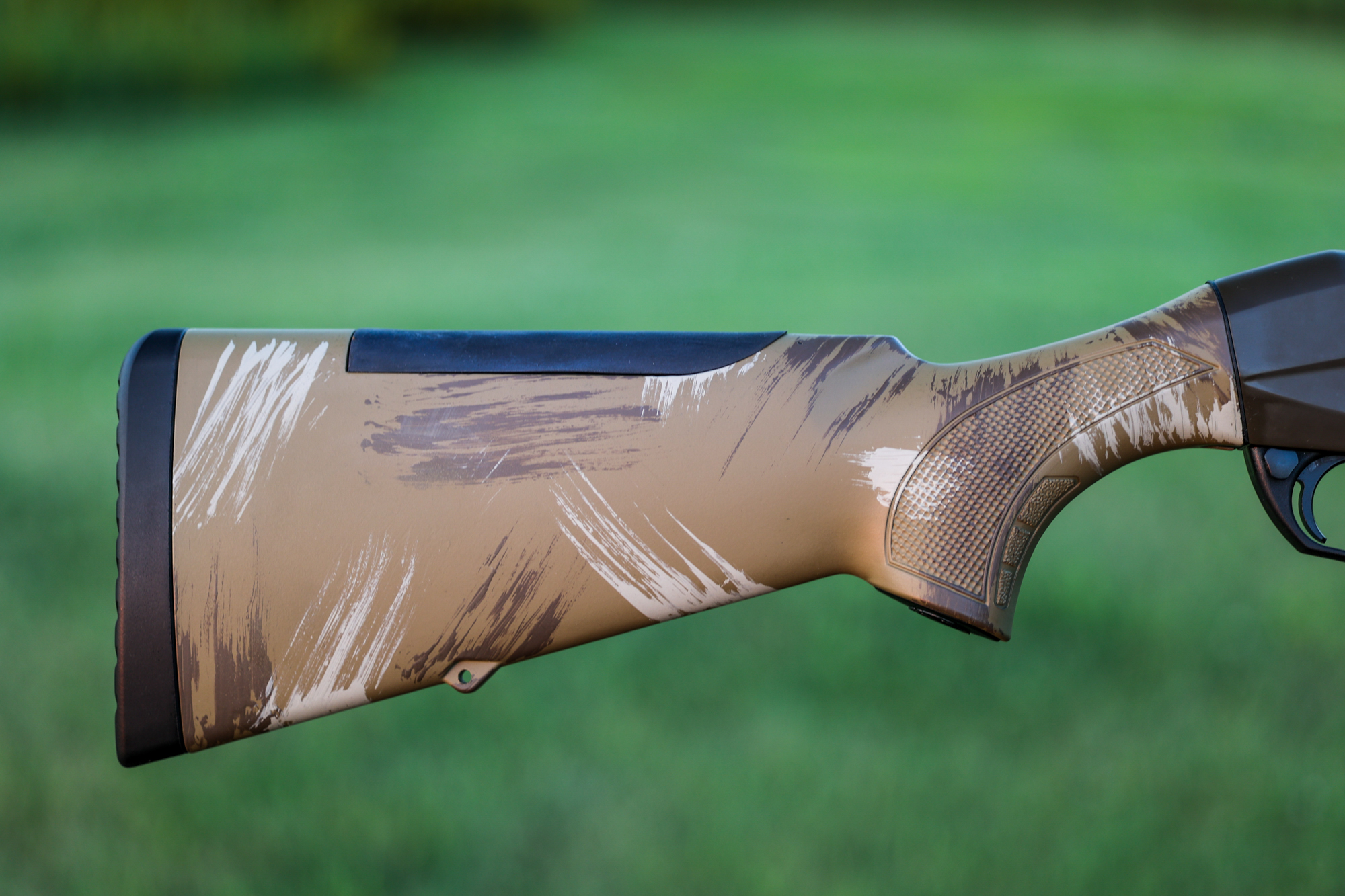 The stock of the Weatherby Sorix brush painted camo shotgun.