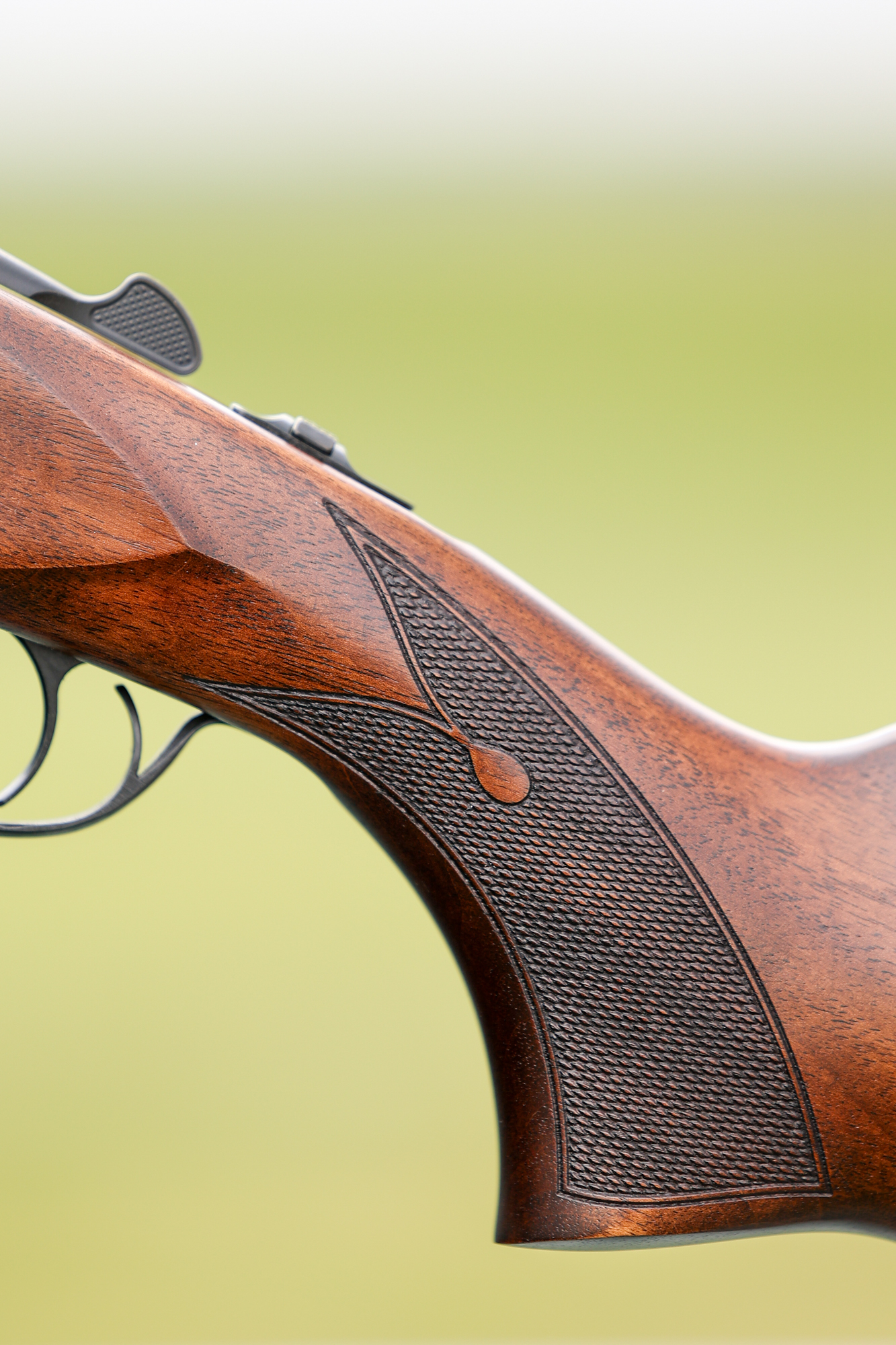 A teardrop in the checkering of the Tristar Cypher o/u shotgun.