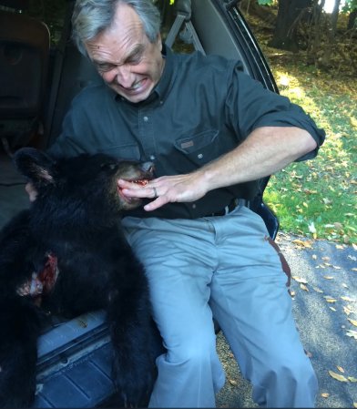 RFK J with the dead black bear cub in 2014.