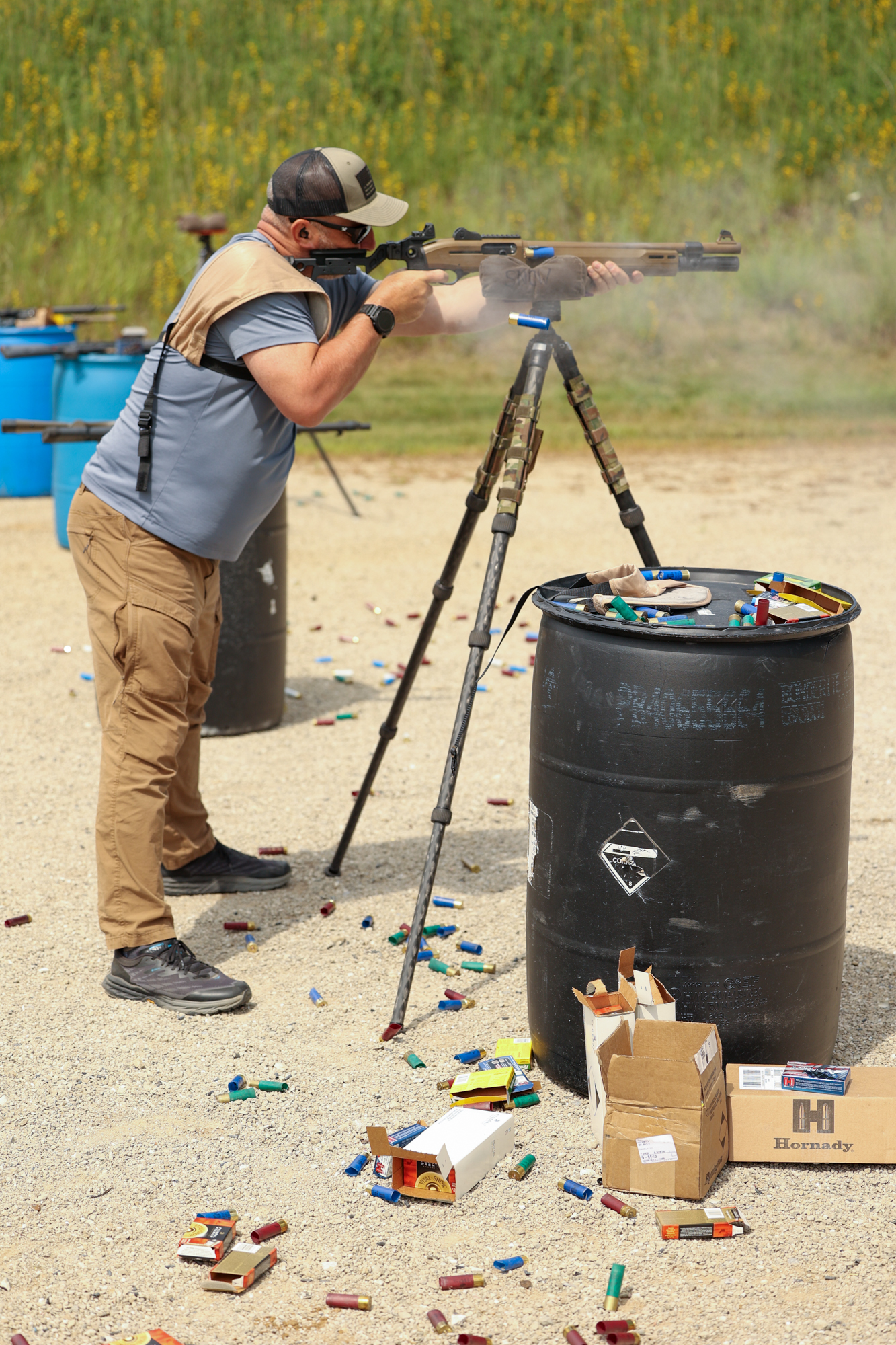 Shooting a tactical shotgun off a bag at the range.