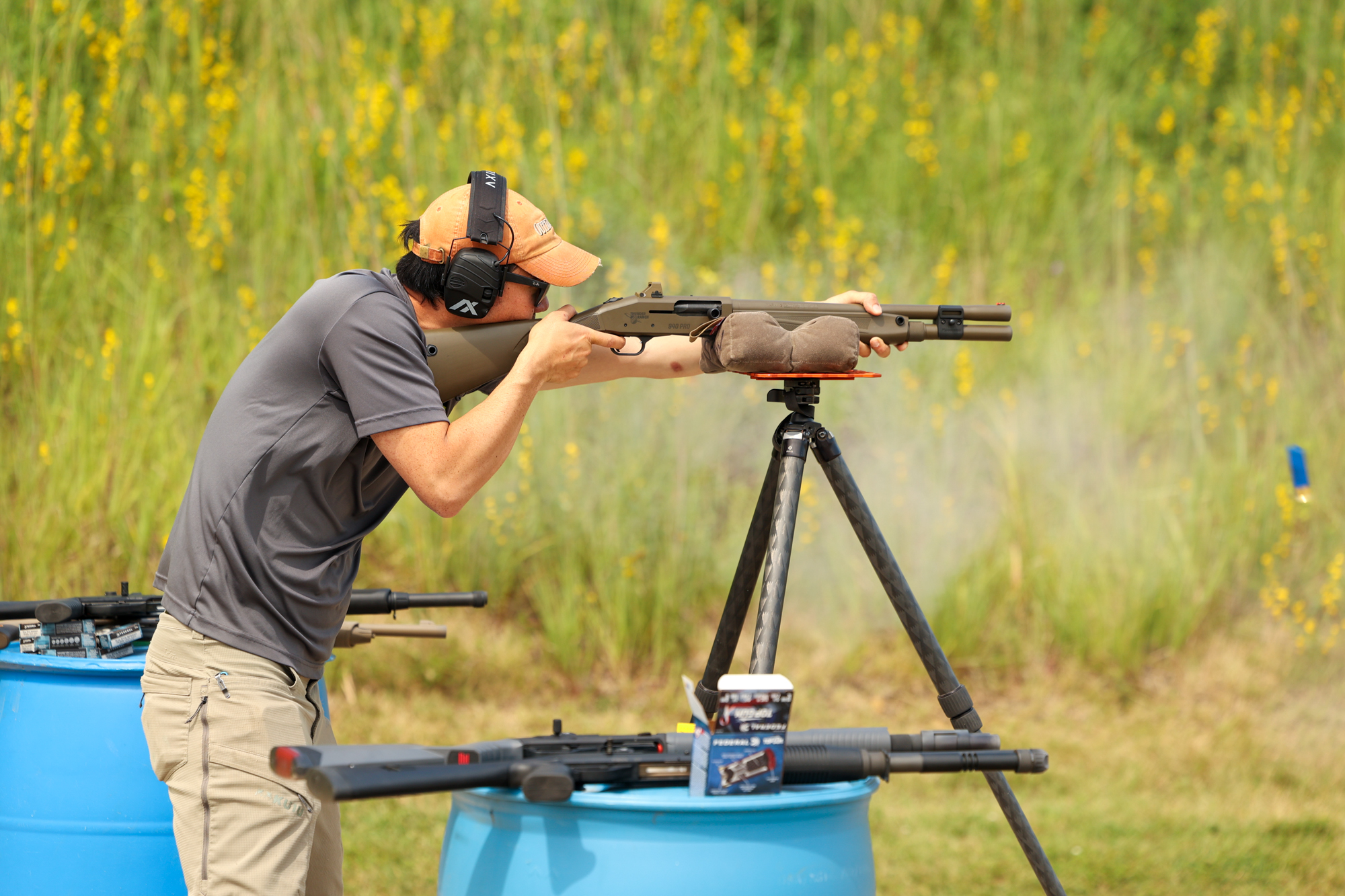 Shooting a shotgun off a tripod.