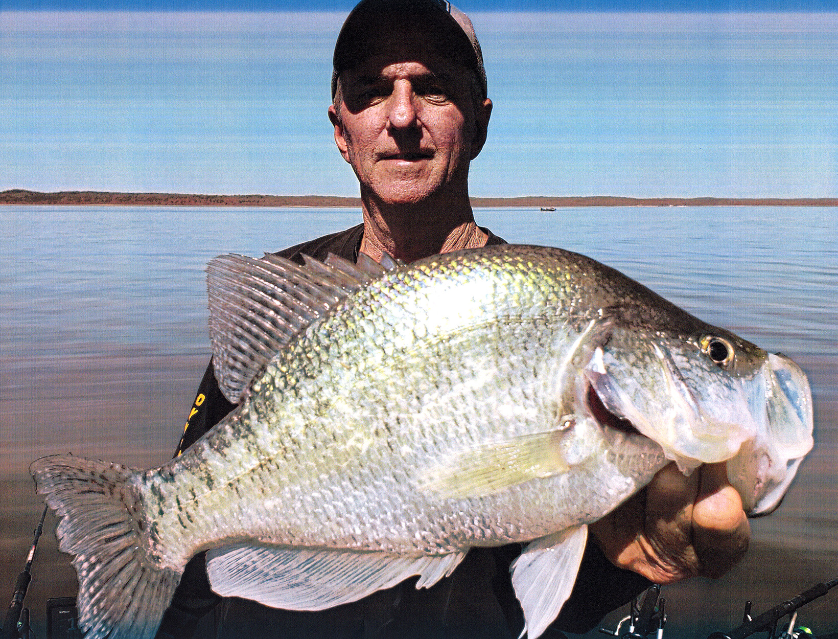 Angler with white crappie.