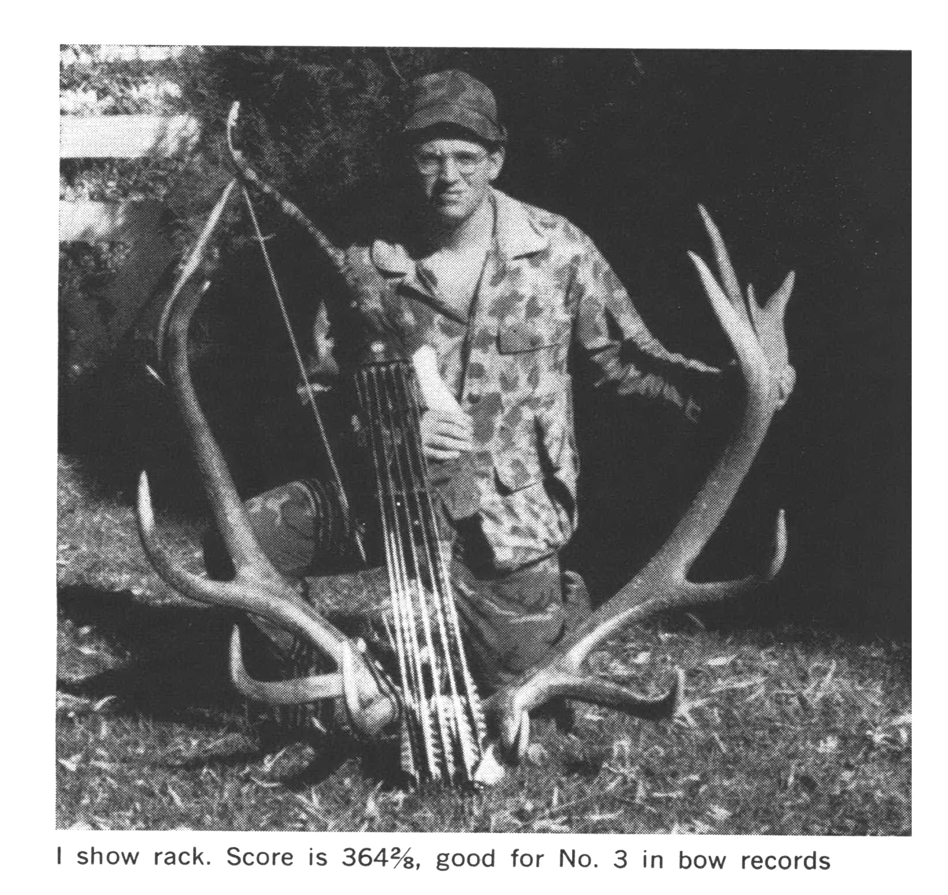 A black and white photo of a vintage hunter with a nice bull elk rack