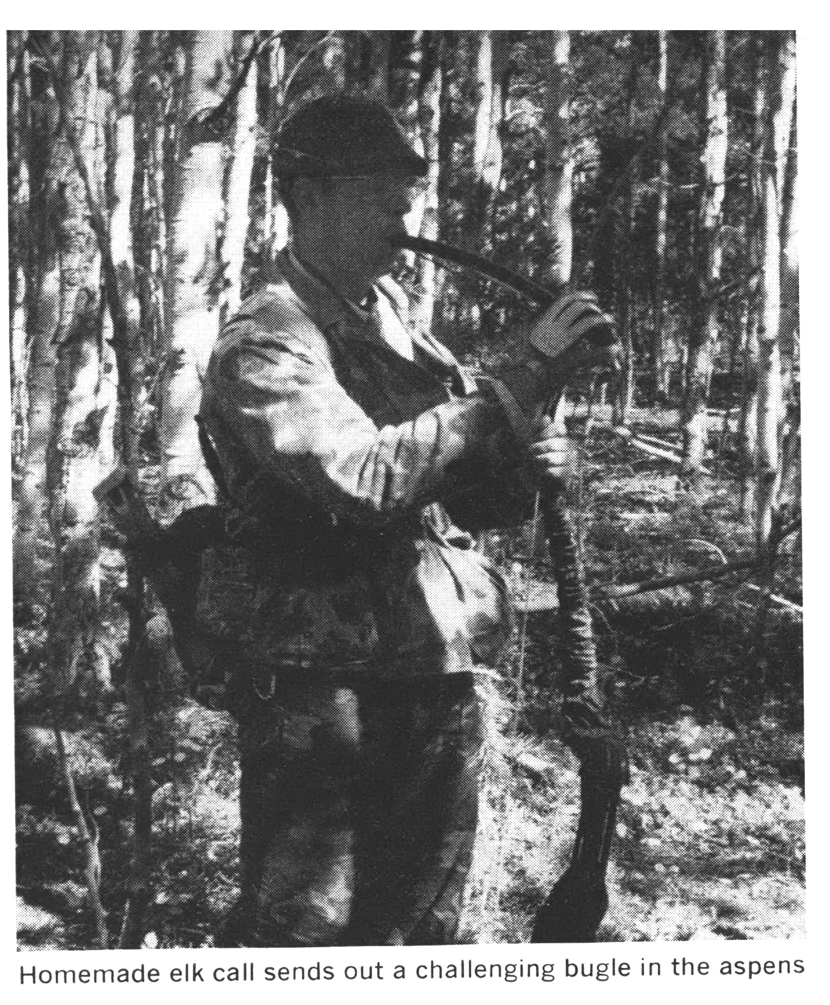 A black and white photo of a hunter with a homemade elk call