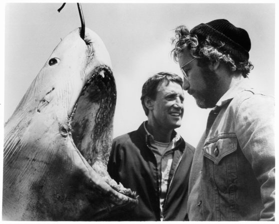 Roy Scheider and Richard Dreyfuss stand next to a giant man-eating great white from the movie Jaws.