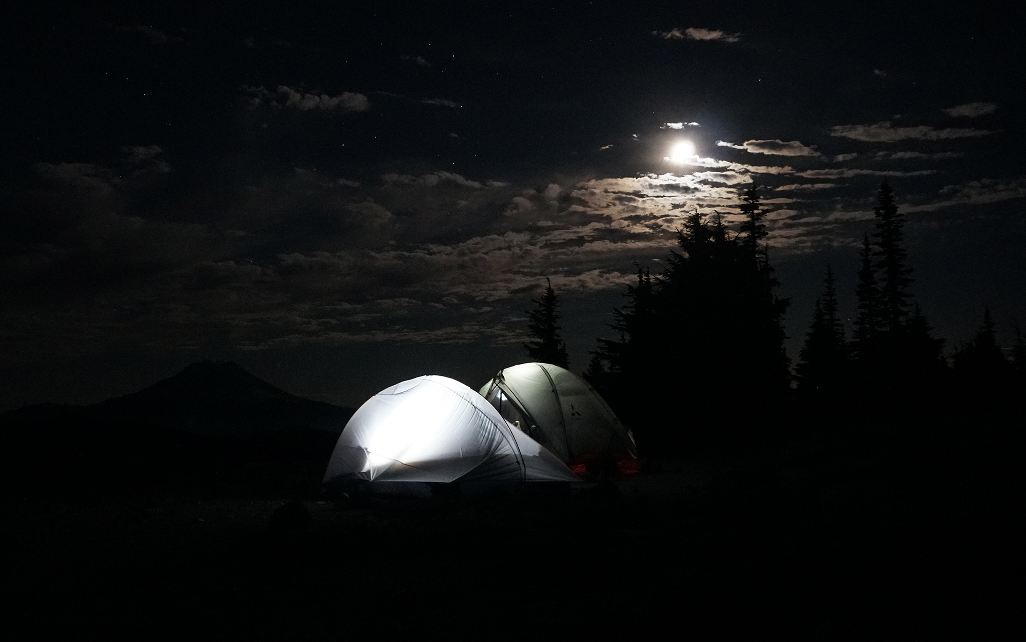 tents glowing at night